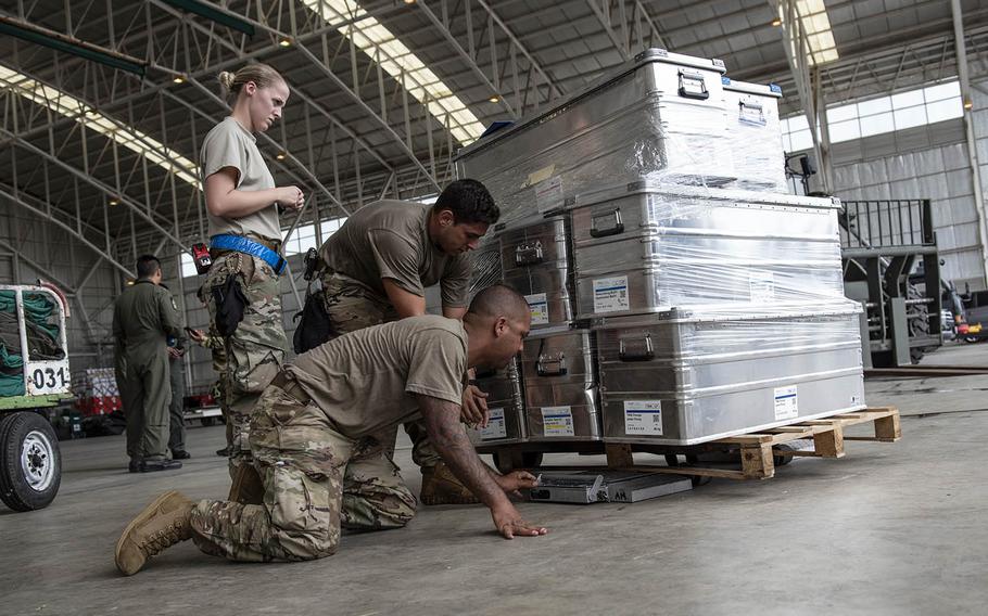 Airmen assigned to the 36th Contingency Response Group at Andersen Air Force Base, Guam, prepare and inspect disaster-relief supplies in Balikpapan, Indonesia, Oct. 5, 2018.