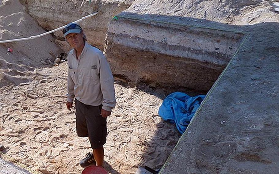 Author Clay Bonnyman Evans stands in 2015 on the Betio Island dig site that held the remains of his grandfather, posthumous Medal of Honor recipient Marine 1st Lt. Alexander Bonnyman Jr.