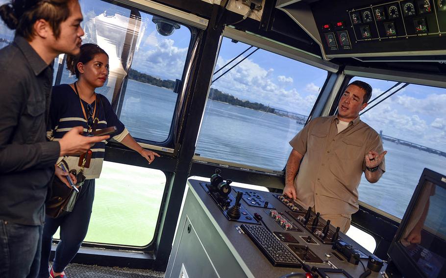 Capt. Charles Black speaks to local media aboard the USNS Fall River during Cooperation Afloat Readiness and Training at Muara Naval Base, Brunei, Nov. 12, 2018.