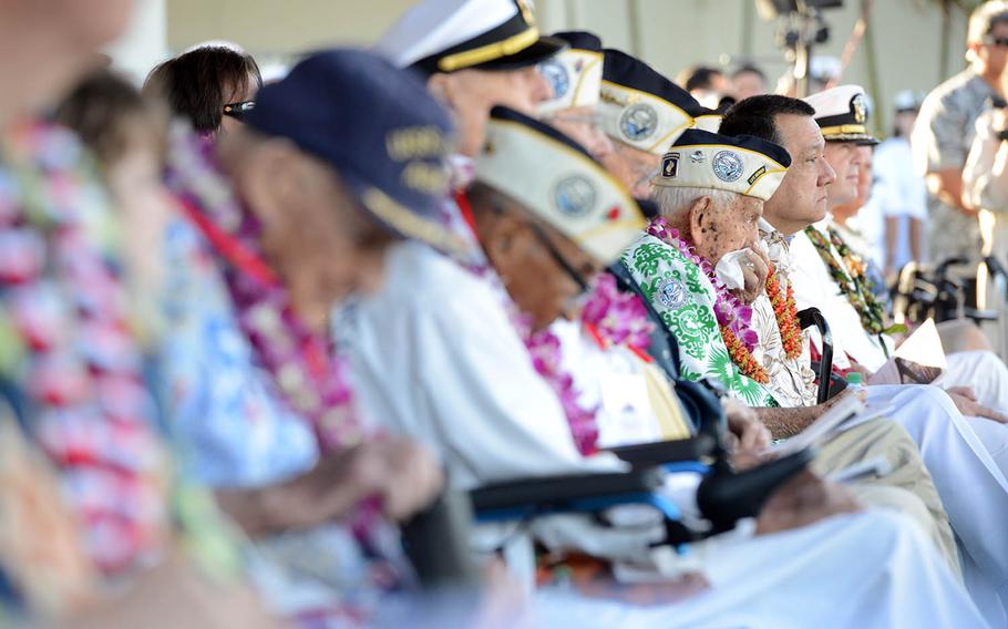 Alfred Benjamin Kameeiamoku Rodrigues, a Pearl Harbor survivor and Hawaii native, wipes his face during the 76th commemoration of the attack on Pearl Harbor at the World War II Valor in the Pacific National Monument in Oahu, Dec. 7, 2017.
