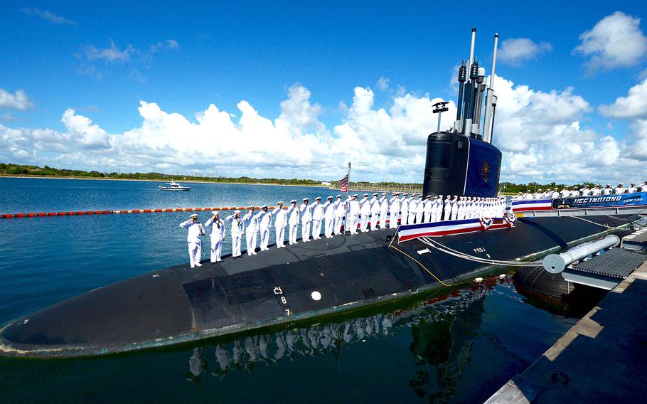 The crew of the fast-attack submarine USS Indiana salute after bringing the ship to life during its commissioning ceremony at Port Canaveral, Fla., Sept. 29, 2018.