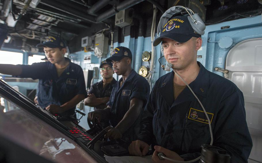 Sailors stand watch on the bridge of the guided-missile cruiser USS Antietam in the Sea of Japan, July 5, 2018.