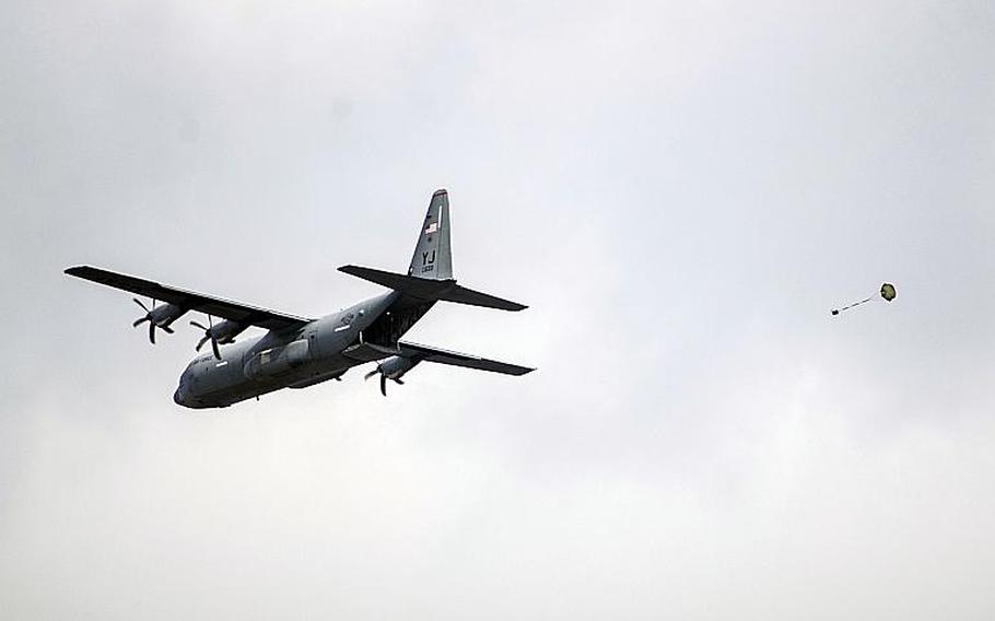 A C-130J Super Hercules makes a drop during the Samurai Surge exercise at Yokota Air Base, Japan, Thursday, Nov. 29, 2018.