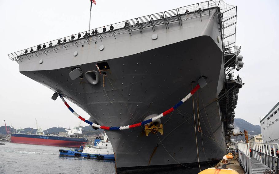 The amphibious-assault ship USS Wasp pulls pierside at Sasebo Naval Base, Japan, Jan. 14, 2018.