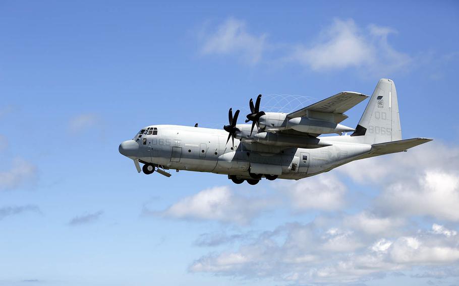 A KC-130J Super Hercules with Marine Aerial Refueler Transport Squadron 152 takes off from Marine Corps Air Station Futenma, Okinawa, July 15, 2014.