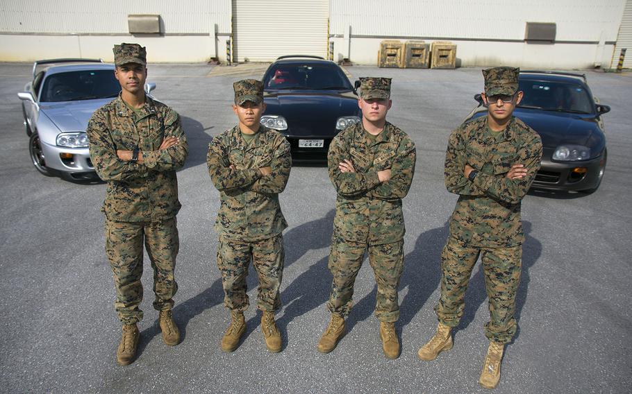 From left to right: 1st Lt. Jose Antonio Diaz Jr., Sgt. David Nguyen Lam, Cpl. Devon Duran-Wernet and Cpl. Gerardo Lujan pose with their cars Jan. 24, 2019, at Camp Foster, Okinawa. The Marines were among those who responded to a motorcycle accident in northern Okinawa on New Year's Eve.