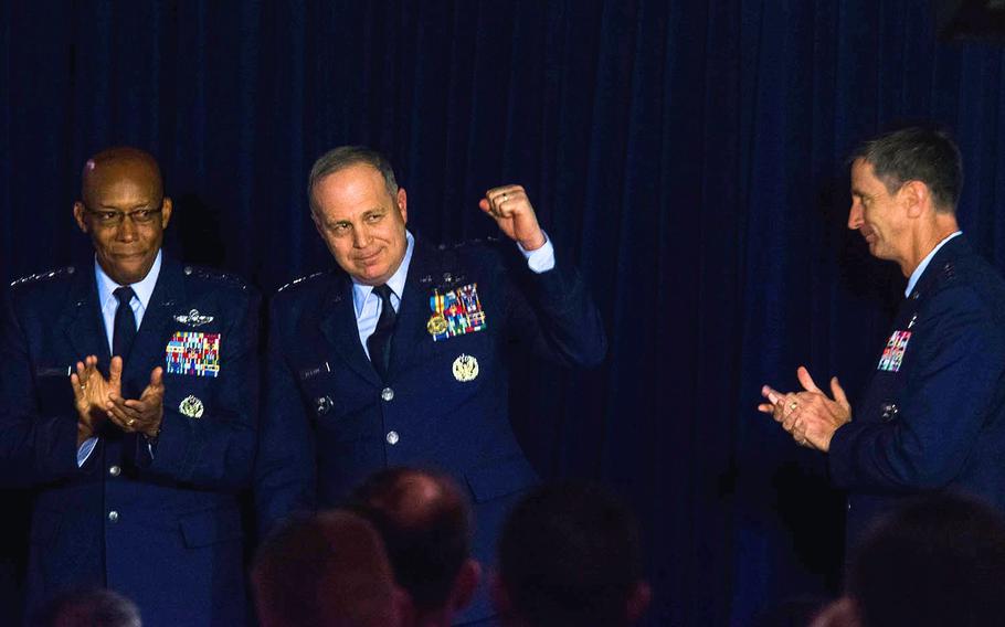 Lt. Gen. Jerry Martinez, center, greets the audience before relinquishing command of U.S. Forces Japan to Lt. Gen. Kevin Schneider, right, at Yokota Air Base in western Tokyo, Tuesday, Feb. 5, 2019. Gen. Charles Brown Jr. of Pacific Air Forces sits at left.