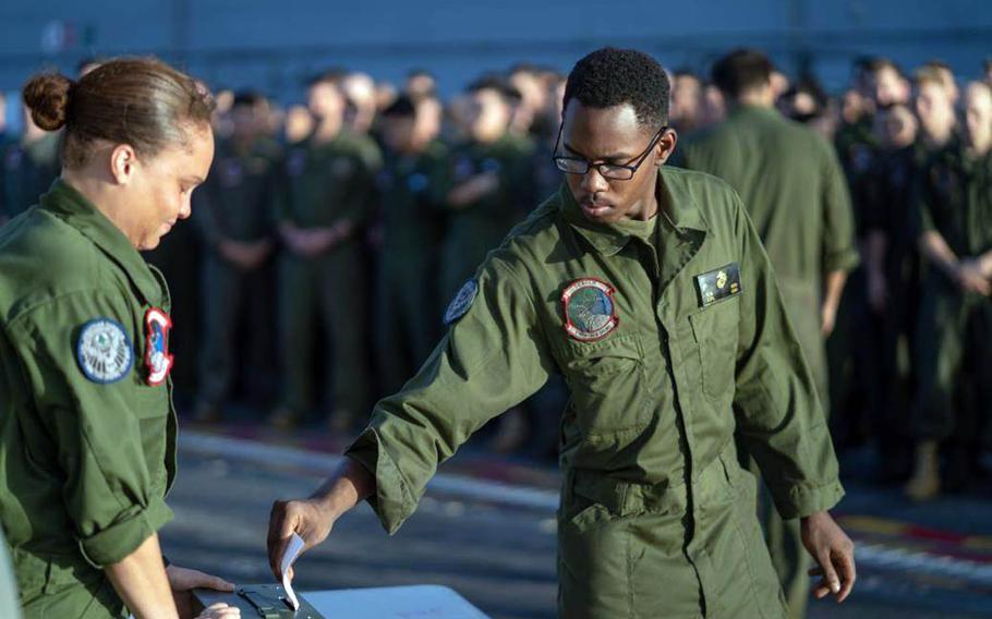 In a photo posted to Facebook on Tuesday, Feb. 12, 2019, a Marine aboard the USS Essex places a message into an ammunition box for Cpl. Jonathan Currier, who was lost in the Sulu Sea in August.