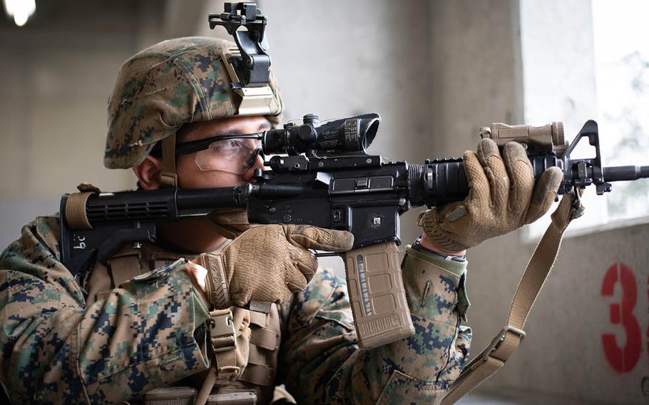 Marine Cpl. J. Martinez-Gomez provides simulated cover fire Feb. 7, 2019, at the Aibano Exercise Area near Takashima, Japan, during Exercise Forest Light 19-2.