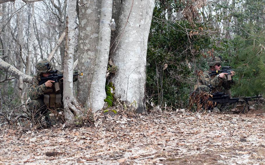 Reserve Marines from 2nd Battalion, 23rd Regiment, prepare to take a building during training at Aibano Exercise Area near Takashima, Japan, Feb. 7, 2019, during Exercise Forest Light 19-2.