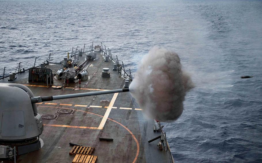 The guided-missile destroyer USS Stethem fires its 5-inch gun while training in the Philippine Sea, Nov. 20, 2017.