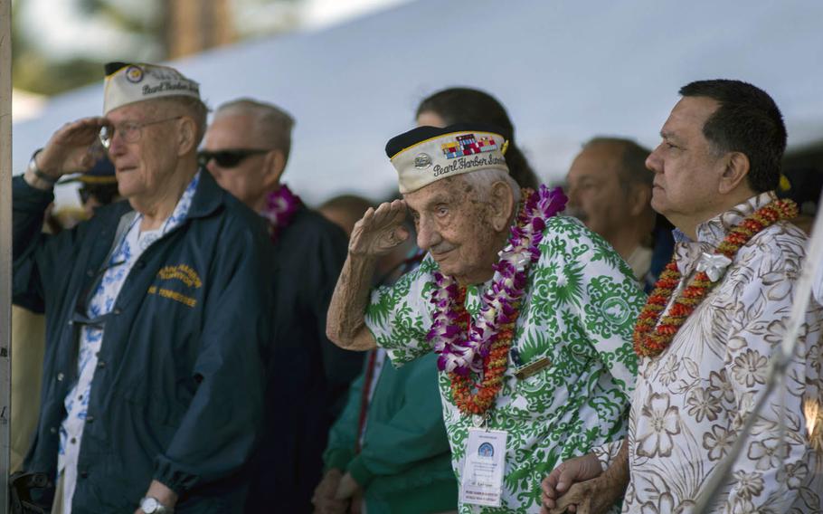 Retired Navy Chief Storekeeper Al Rodrigues, center, is shown here rendering honors at Joint Base Pearl Harbor-Hickam, Hawaii, on Dec. 7, 2017. He died Sunday, Feb. 24, 2019, at age 99.