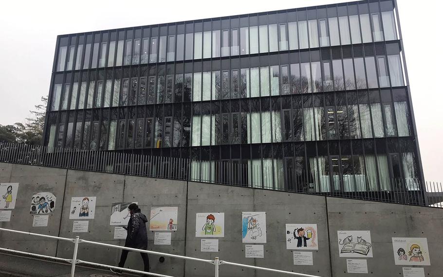 A man walks by the Embassy of Germany in central Tokyo, Wednesday, March 6, 2019.