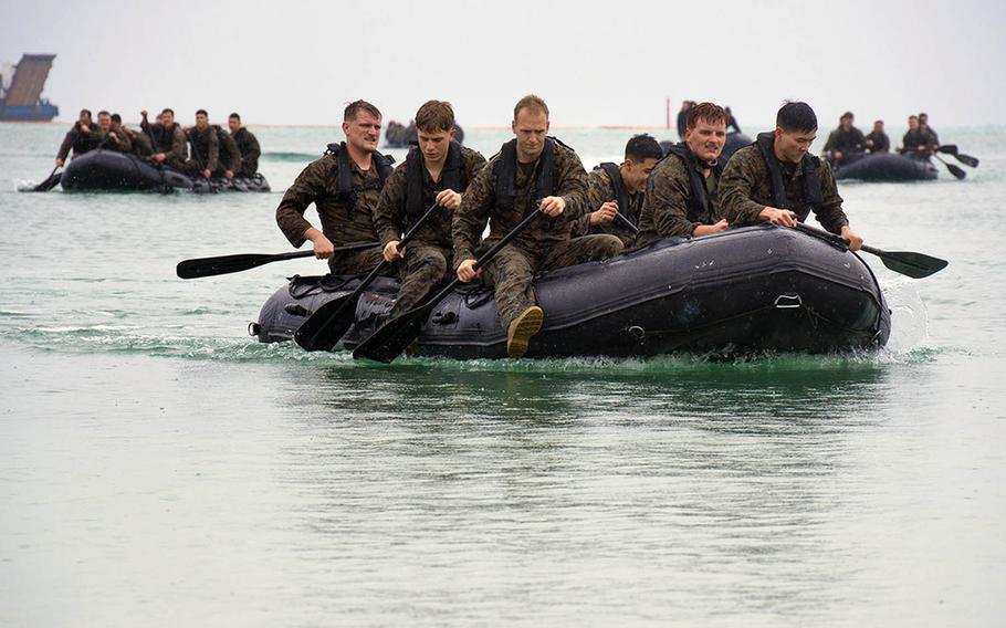 Marines of 3rd Reconnaissance Battalion paddle in a small boat during the Warrior Challenge at Camp Schwab, Okinawa, March 8, 2019.