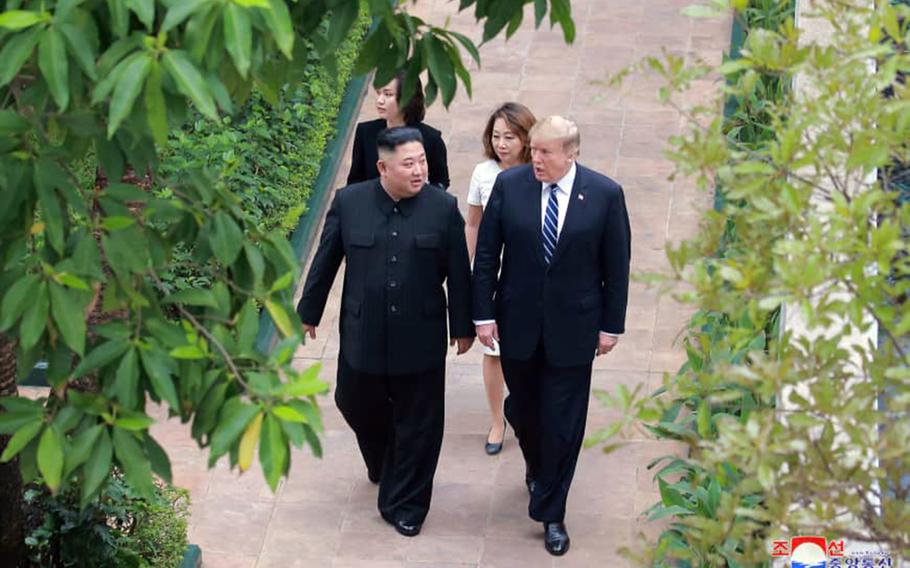 President Donald Trump walks with North Korean leader Kim Jong Un during their second summit in Hanoi, Vietnam, in this photo released by the Korean Central News Agency.