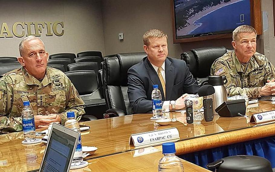 Left to right: Gen. Robert Brown, U.S. Army Pacific commander; Ryan McCarthy, Army under secretary; and Gen. James McConville, vice chief of staff of the Army, speak with reporters at Fort Shafter, Hawaii, Tuesday, March 19, 2019.