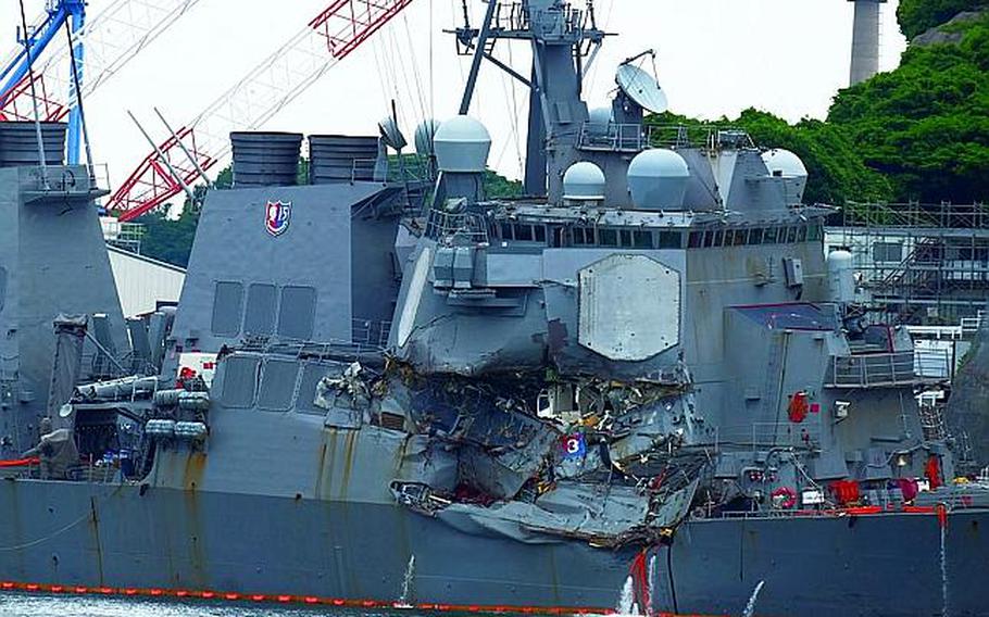 The collision-damaged destroyer USS Fitzgerald is seen at Yokosuka Naval Base, Japan, Sunday, June 17, 2017.