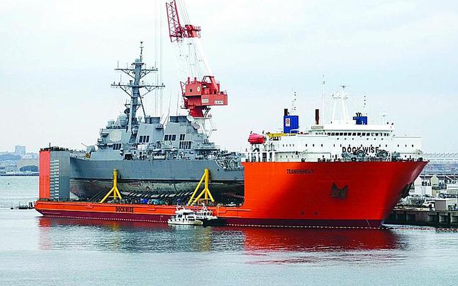 The USS Fitzgerald is seen at Yokosuka Naval Base, Japan, aboard the MV Transshelf, Monday, Nov. 27, 2017.