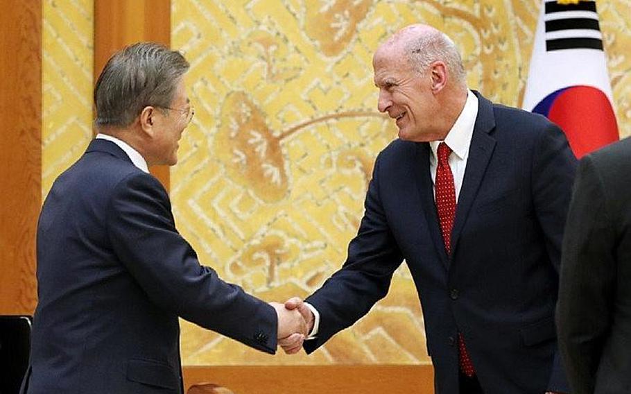 South Korean President Moon Jae-in greets Director of National Intelligence Dan Coats during a meeting in Seoul on Wednesday, March 20, 2019.