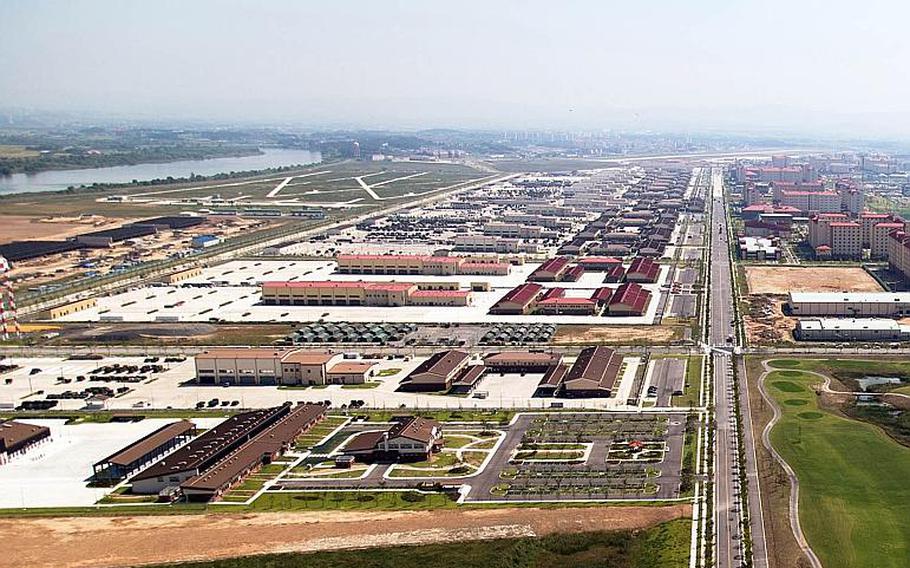 Motorpool row sits across from the barracks at Camp Humphreys, South Korea, as seen in September 2017.