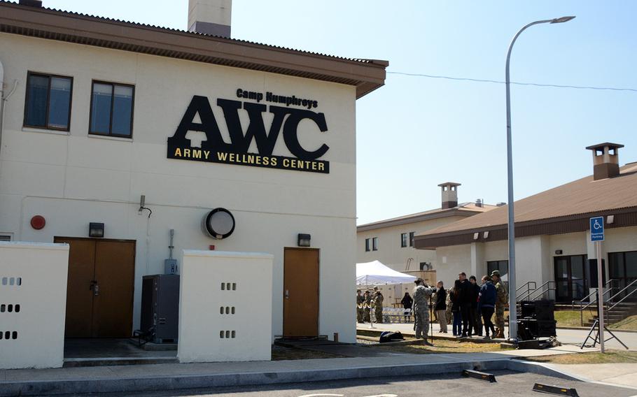 Soldiers and civilians gather for the ribbon-cutting ceremony for the Army Wellness Center at Camp Humphreys, South Korea, Friday, March 22, 2019.