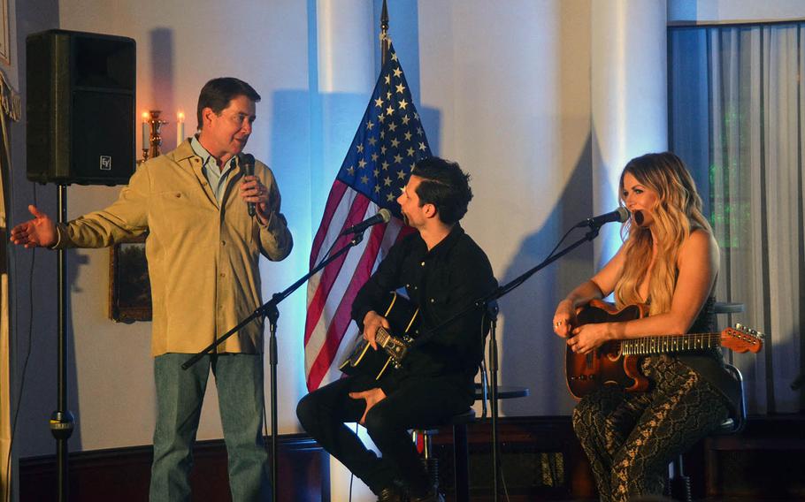 Ambassador to Japan William Hagerty, left, speaks to country music artists Devin Dawson and Lindsay Ell at his home in Tokyo on Thursday, March 28, 2019.