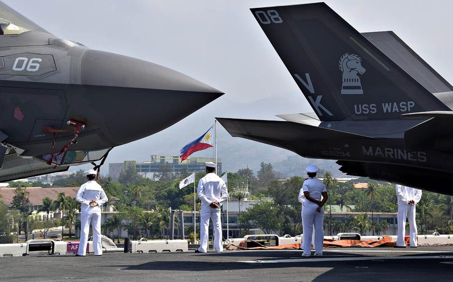 Sailors man the rails aboard the amphibious assault ship USS Wasp while arriving in Subic Bay, Philippines, for the Balikatan exercise, Saturday, March 30, 2019.