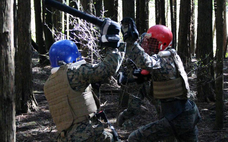 Marines spar during a Marine Corps Martial Arts Instructor Course at Combined Arms Training Center Camp Fuji, Gotemba, Japan, on Wednesday, April 10, 2019.