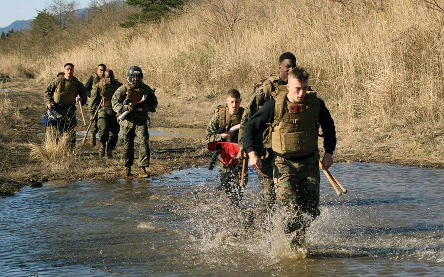 Marines head for Marine Corps Martial Arts Instructor Course sparring matches at Combined Arms Training Center Camp Fuji, Gotemba, Japan, on April 10, 2019.