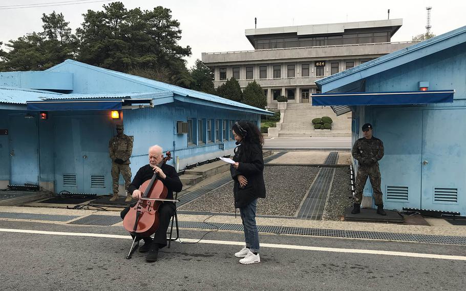 American cellist Lynn Harrell performs in front of the spot on the Military Demarcation Line where the South and North Korean leaders met during the first inter-Korean summit. Several musicians performed to celebrate the summit's first anniversary in the truce village of Panmunjom, Saturday, April 27, 2019.