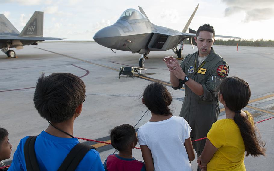 A pilot answers questions about the F-22 Raptor at the Francisco C. Ada International Airport, Saipan, during exercise Resilient Typhoon, April 23, 2019.