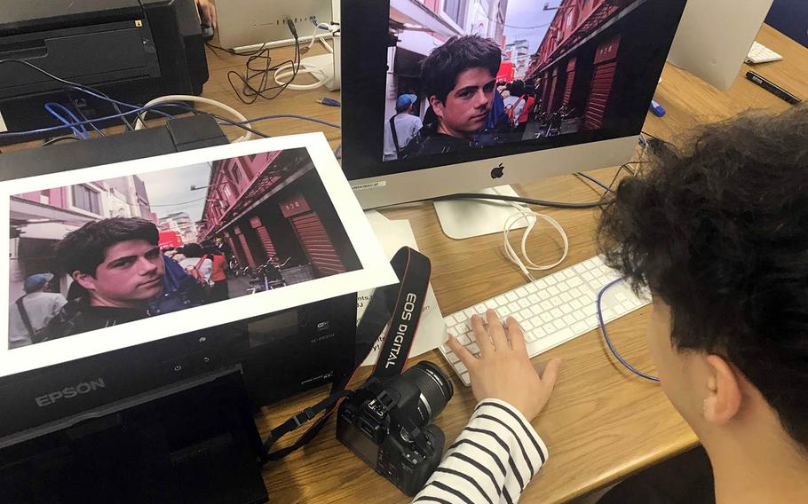 Ethan Martin, a senior at Humphreys High School in South Korea, edits a photograph during the Far East Film and Creative Expressions Festival in Tokyo, May 2, 2019.