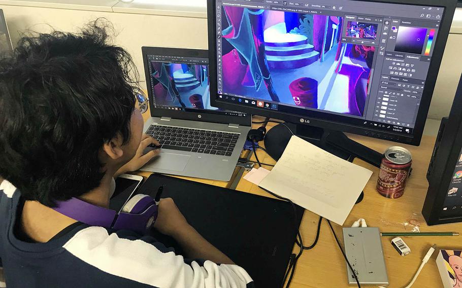 Alex Dasigan, a senior at Kadena High School on Okinawa, works on a digital art project during the Far East Film and Creative Expressions Festival in Tokyo, May 2, 2019.