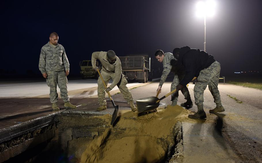 Airmen from the 8th Civil Engineer Squadron work to repair a sinkhole in the runway at Kunsan Air Base, South Korea, May 1, 2019.