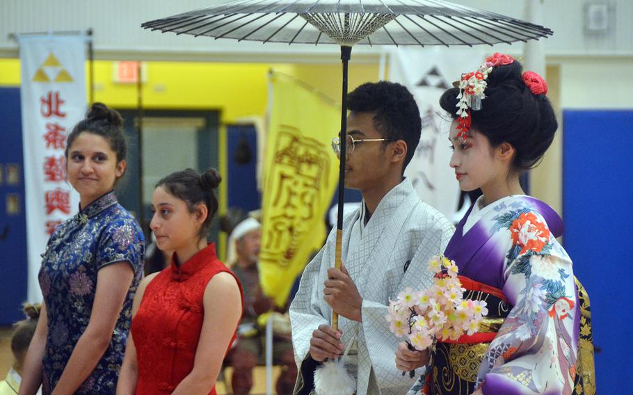 Students wear traditional clothing during the Asian American Pacific Islander Heritage Month celebration at Yokota Air Base, Japan, Monday, May 6, 2019.