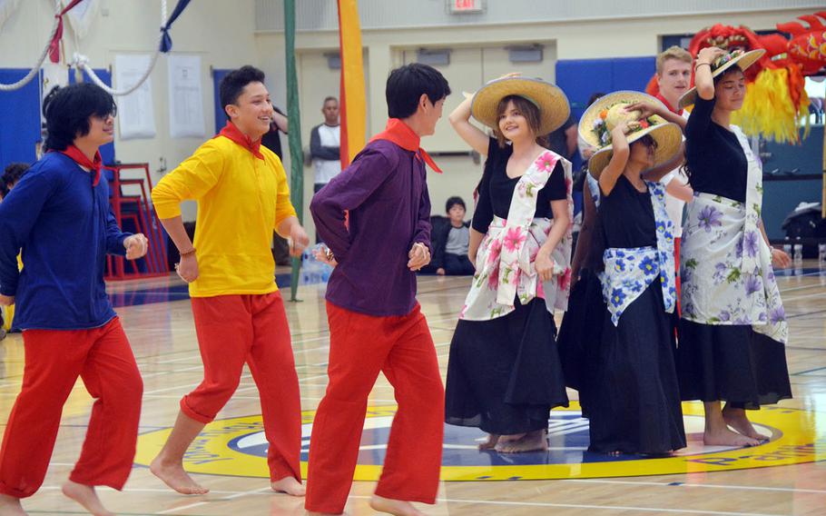 High schoolers perform a Philippine hat dance during an Asian American Pacific Islander Heritage Month celebration at Yokota Air Base, Japan, Monday, May 6, 2019.