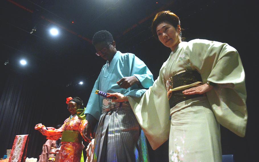 Students and volunteers show off traditional Japanese clothing during the Asian American Pacific Islander Heritage Month celebration at Yokota Air Base, Japan, Monday, May 6, 2019.