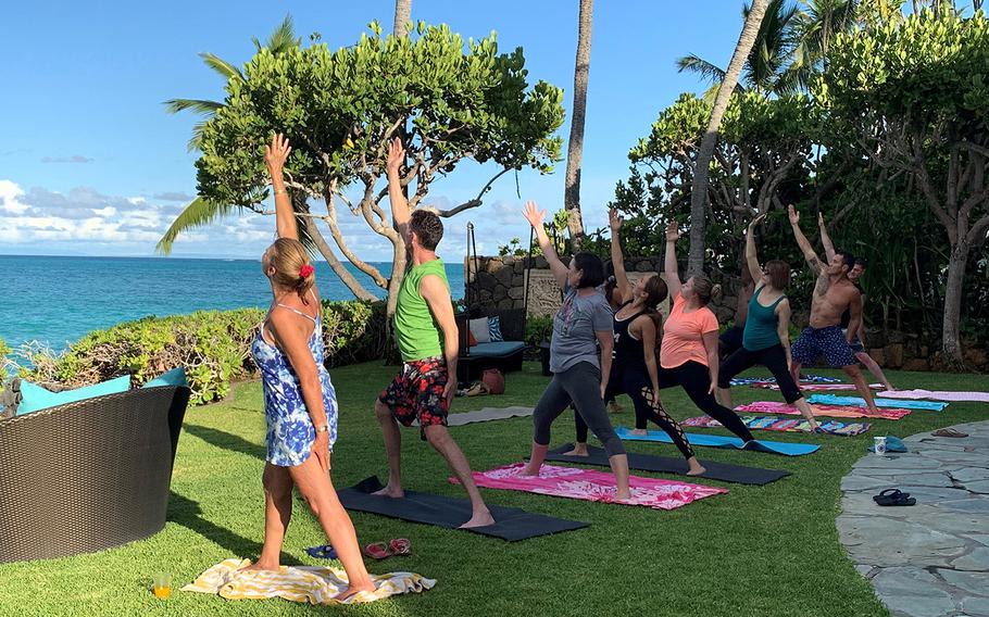 This undated photo shows Gold Star family members practicing yoga at the Paul Mitchell Estate in Lanikai, Hawaii.