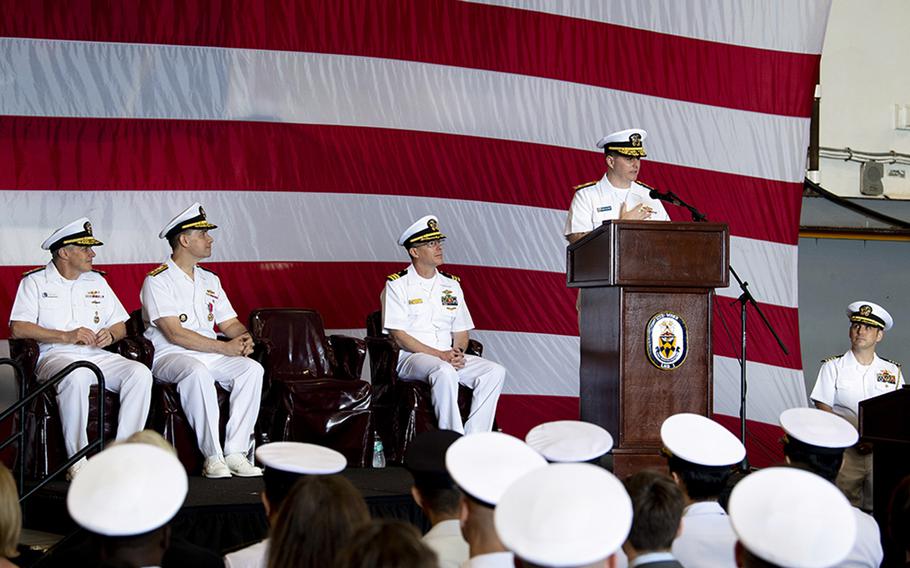 Rear Adm. Fred Kacher addresses his sailors after assuming command of the amphibious force for 7th Fleet from Rear Adm. Brad Cooper aboard the USS Wasp at Sasebo Naval Base, Japan, May 17, 2019.