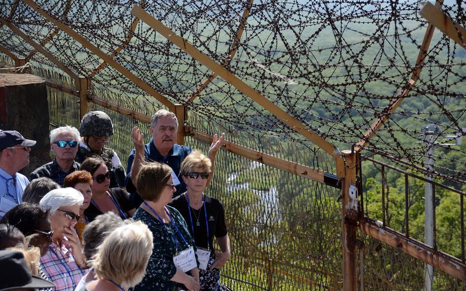 Relatives of American servicemembers who remain missing from the 1950-53 Korean War get a briefing on remains recovery efforts during a visit to the former battleground known as Arrowhead Hill in the Demilitarized Zone, May 29, 2019.