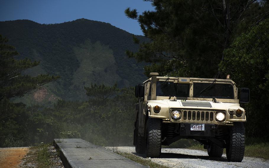 Marines take a Humvee through the Advanced Motor Vehicle Operations Course at Camp Schwab, Okinawa, May 23, 2019.