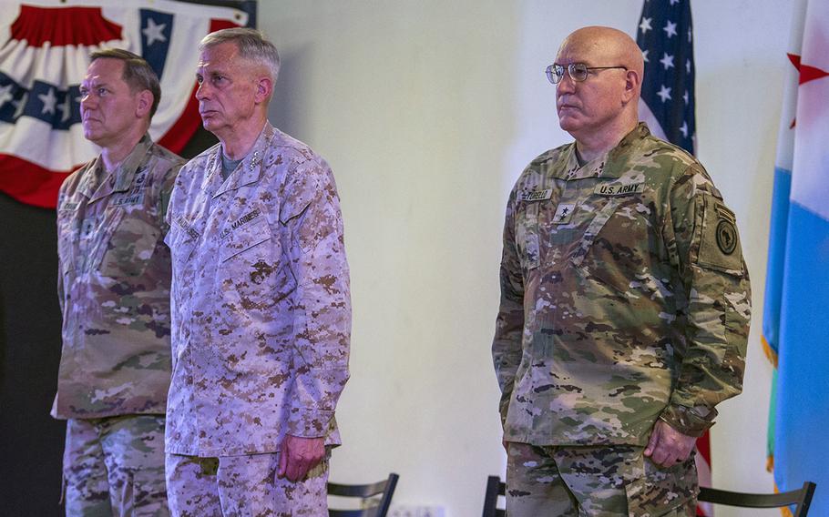U.S. Marine Corps Gen. Thomas Waldhauser, commander of U.S Africa Command, middle, presides over a change of command ceremony transferring authority of Combined Joint Task Force-Horn of Africa from U.S. Army Maj. Gen. James D. Craig, left, to U.S. Army Maj. Gen. Michael D. Turello at Camp Lemonnier, Djibouti, June 12, 2019.
