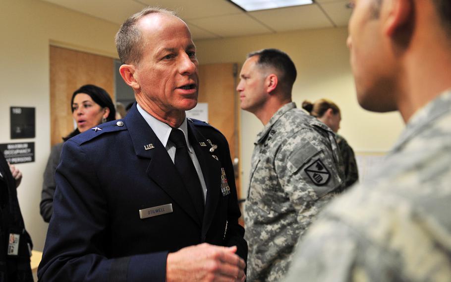 Then-Air Force Brig. Gen. David Stilwell offers advice to a newly minted foreign area officer during a conference at the Defense Language Institute Foreign Language Center in Monterey, Calif., Jan. 14, 2014.