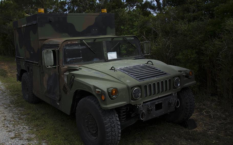 A Marine Corps Humvee is parked at the entrance of the Advanced Motor Vehicle Operations Course at Camp Schwab, Okinawa, May 23, 2019.