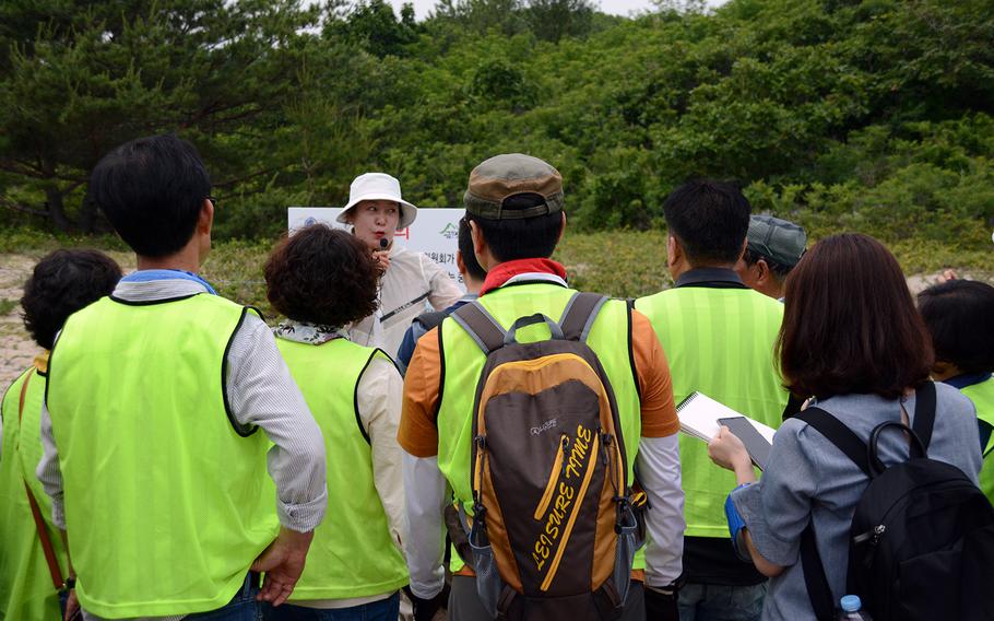 Tour guide Park Jeung Hey speaks to South Koreans participating in a hike on Friday, June 14, 2019, on the Goseong DMZ Peace Trail, which was recently opened to civilians in the northeastern part of the heavily fortified border area.