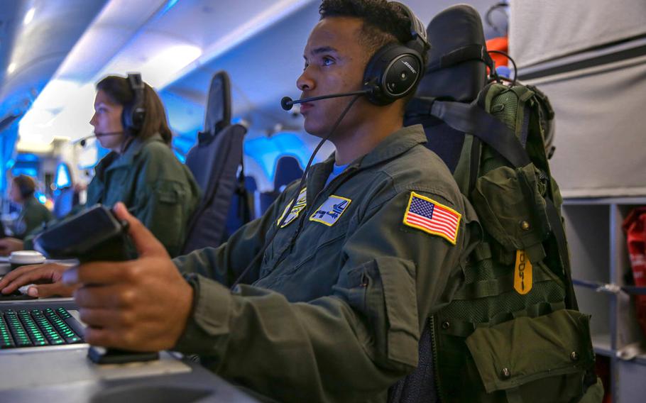 Petty Officer3rd Class Keith Manning, assigned to the ''Golden Eagles'' of Patrol Squadron 9, conducts an anti-submarine warfare exercise aboard a P-8A Poseidon aircraft over the Baltic Sea, June 14, 2019, as part of exercise BALTOPS.