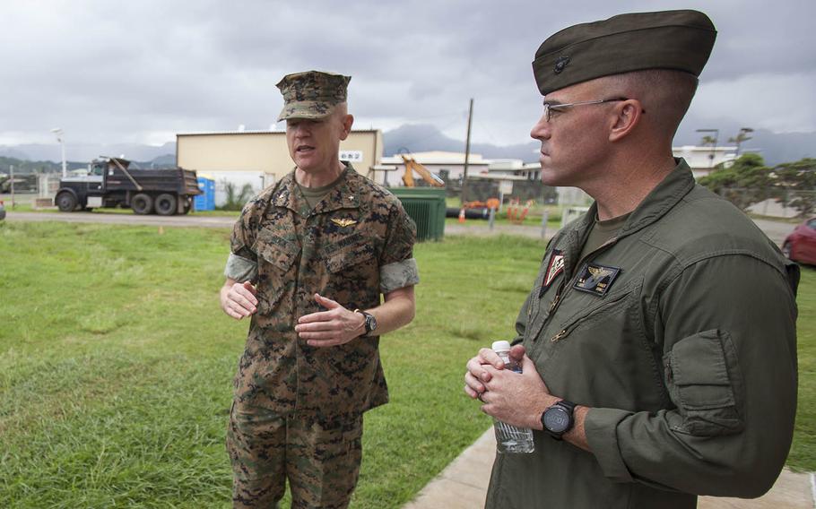 Then-Brig. Gen. Paul Rock Jr., left, commander of Marine Corps Installations Pacific, and Lt. Col. Nathaniel Baker, commander of Marine Corps Air Station Kaneohe Bay, speak outside the base's air traffic control tower, Oct. 15, 2018.