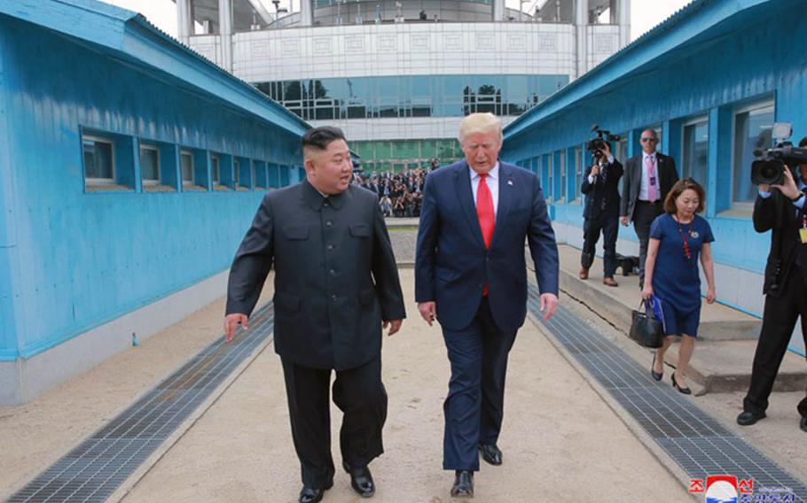 President Donald Trump, shown here with North Korean leader Kim Jong Un, walks into North Korean territory on Sunday, June 30, 2019.