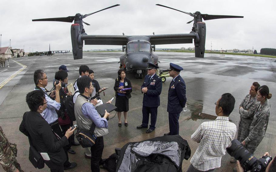 Lt. Col. Jason Hock, commander of the newly activated 21st Special Operations Squadron (left) and Maj. Larry Sepassi, commander of the newly activated 753rd Special Operations Maintenance Squadron speak with reporters after the commands' activation ceremony on Yokota Air Base, Japan,  Monday, July 1, 2019. 