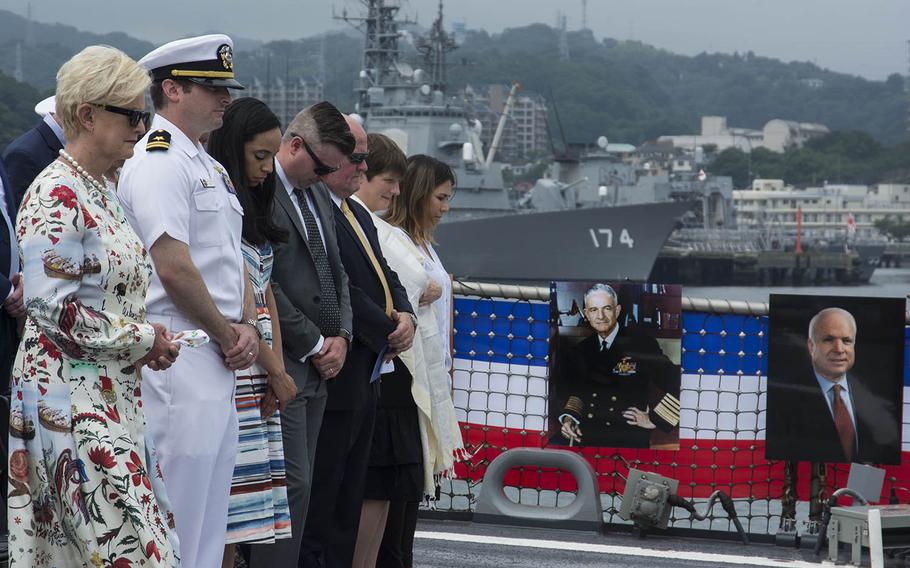 Cindy McCain and sons Lt. Jack McCain and Jimmy McCain attend a change-of-command ceremony aboard the USS John S. McCain at Yokosuka Naval Base, Japan, Tuesday, July 2, 2019. The event took place on the 25th anniversary of the destroyer’s commissioning.